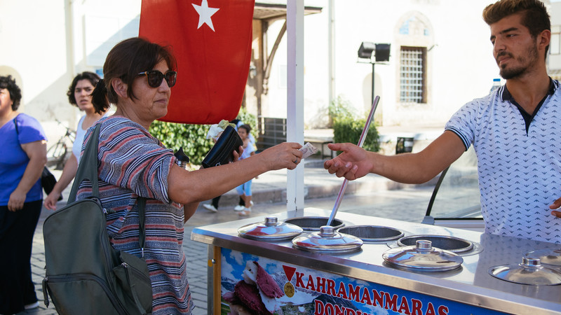 A hungry traveller buying a Turkish ice cream in Antalya