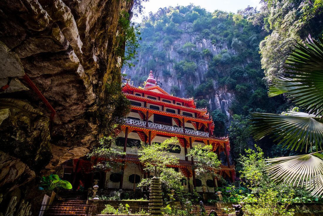 Perak Cave Temple pagoda roof exterior in an open cave in rainforest near Ipoh, Malaysia