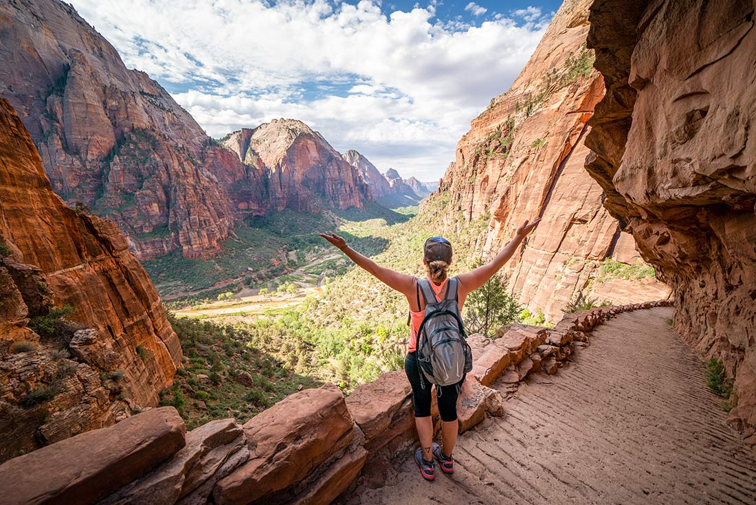 Hiker revelling in views en route to Angel's Landing in Zion National Park, Utah, USA