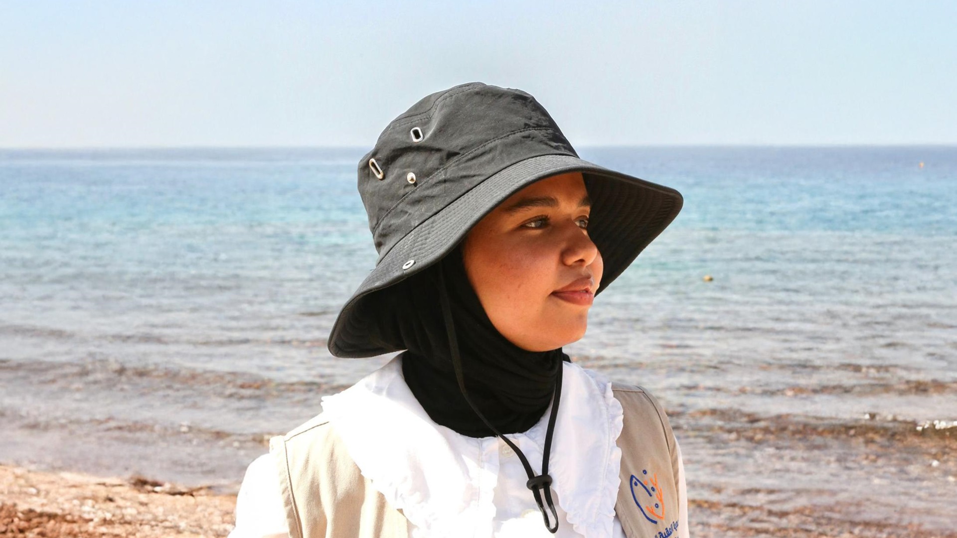 B’dour Abu Bader standing in front of the sea