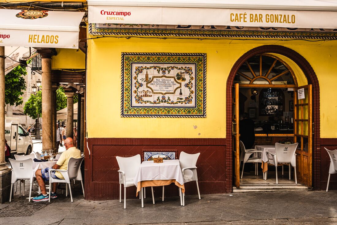 Street and exterior of Cafe Bar Gonzalo in Seville Spain