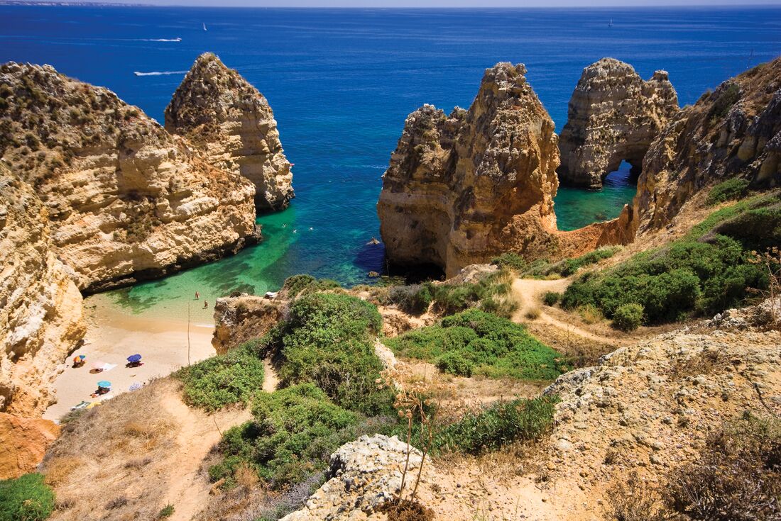 Stone pillars and cliffside paths to Algarve gorgeous beaches on the Portuguese coast
