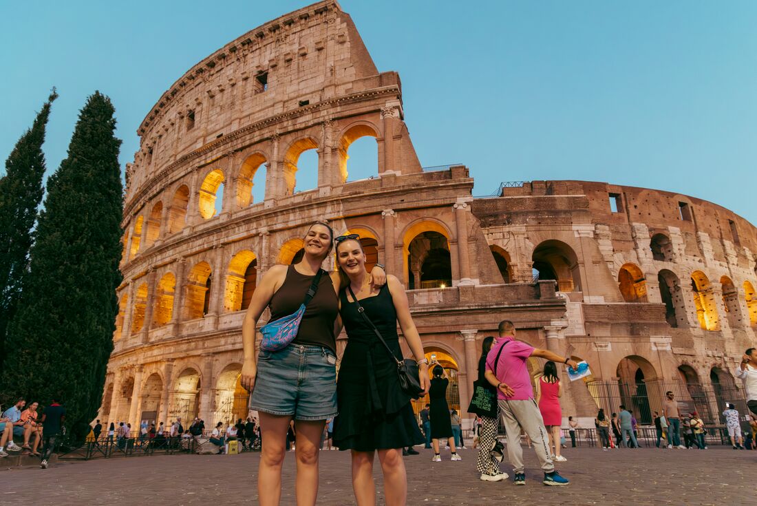 Arist Rachel Sarra poses with a friend at Rome's Colosseum