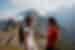 Traveller and leader stop and smile at the lookout of Machu Picchu