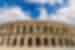 Travellers walk by the Roman ampitheatre Arena of Nimes in Provence France
