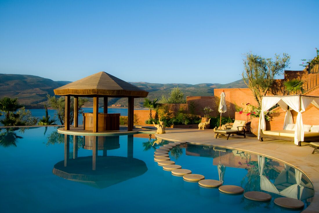 Find a serene moment poolside at Widiane Resort Hotel in the mountains of Morocco