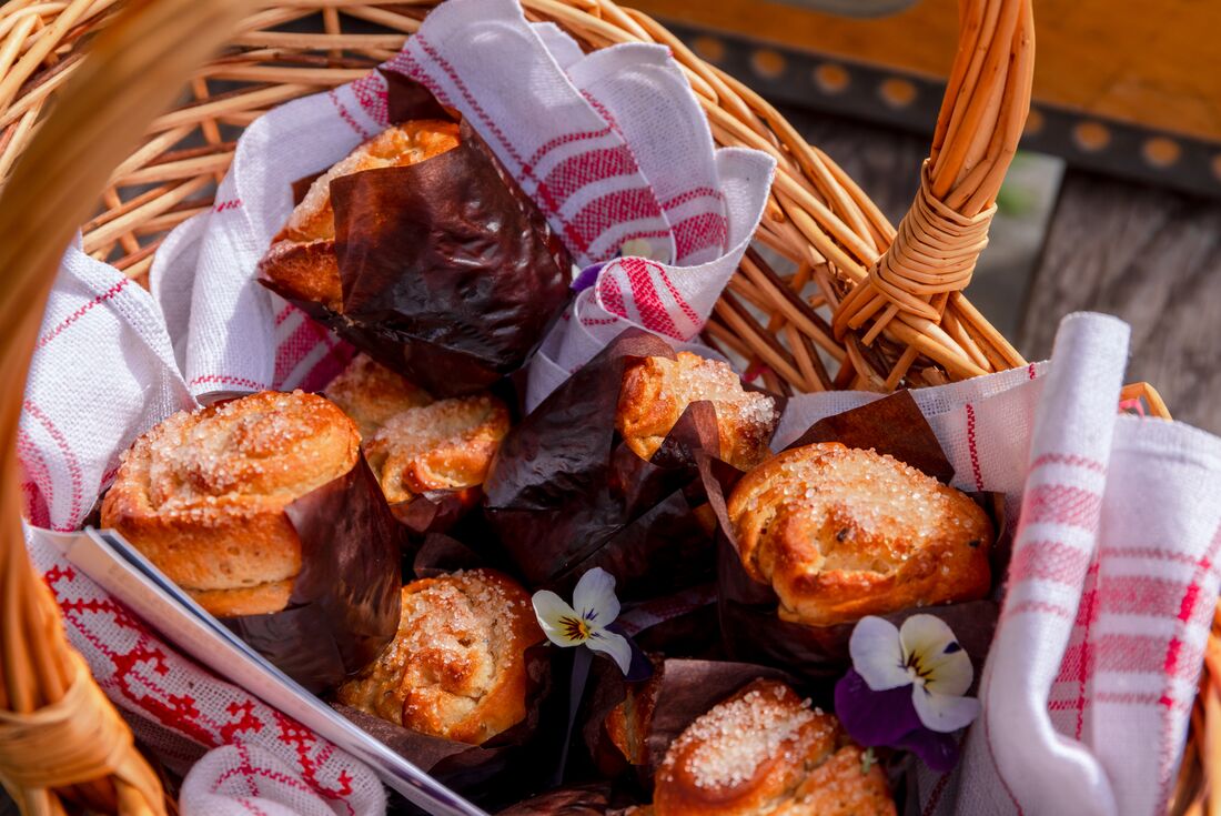 Basket of fresh baked cardamom buns for traditional swedish fika, coffee and pastry, in Alingsås