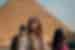 Travellers in front of a Pyramid in Giza, Cairo, Egypt