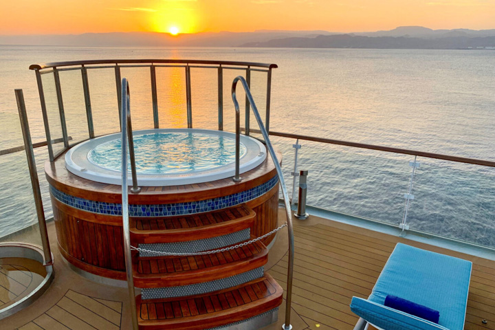 Jacuzzi on upper deck of the Oceean Explorer with Arctic sunset in background