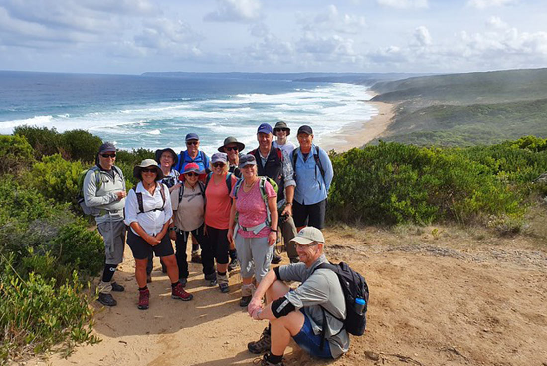 Group posing at Station Beach along the Great Ocean Walk, Victoria, Australia