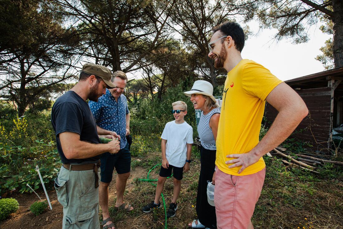 Family of Intrepid travellers with workers and leader at Cooperativa Corragio near Rome Italy