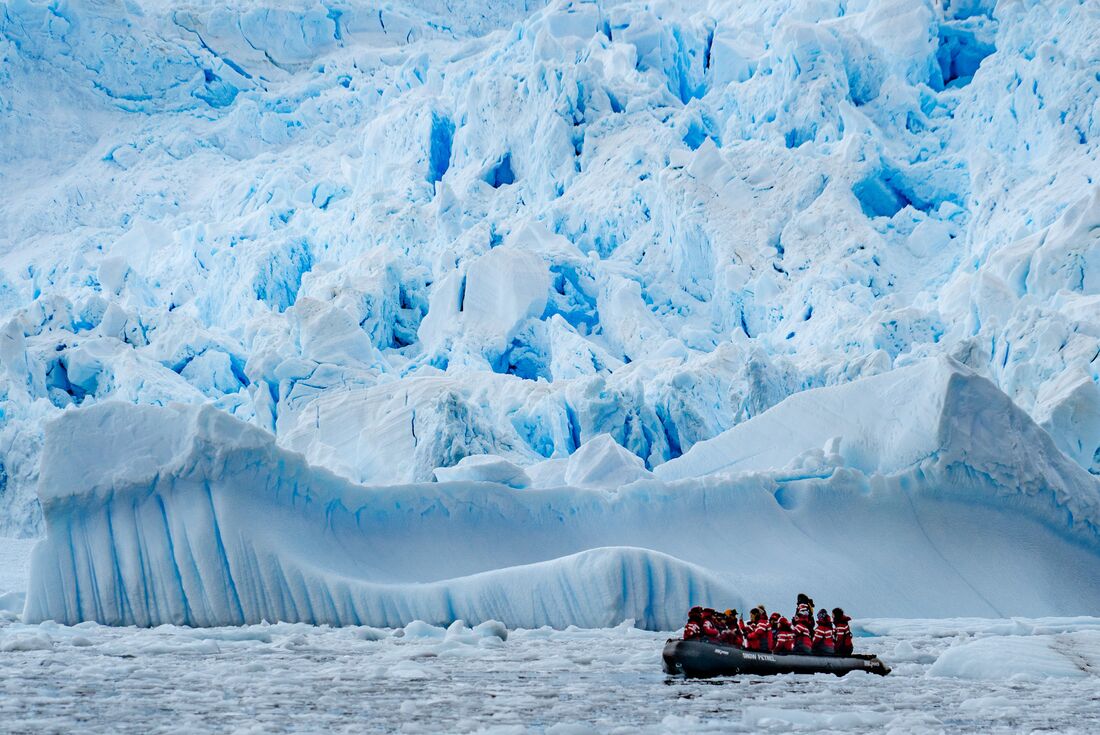 The sheer scale of Antarctica's glaciers will leave you in awe as you get up close on a zodiac cruise